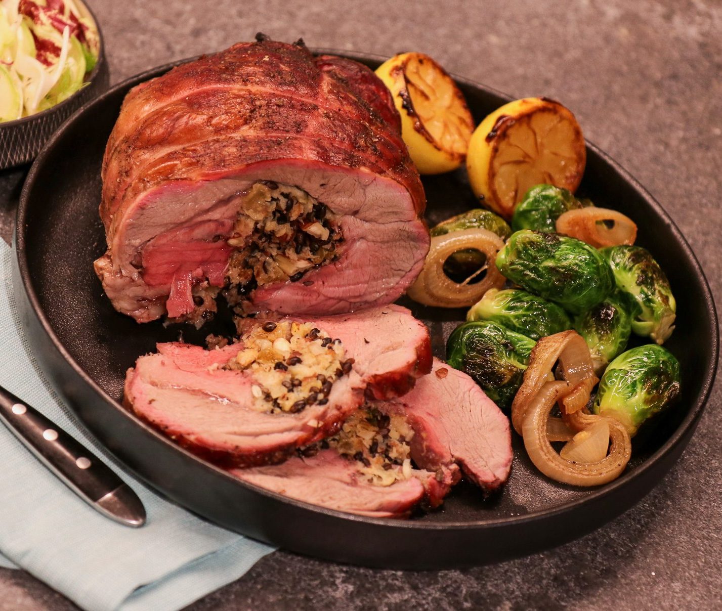 Photo of Rolled Dairy Capretto Goat Leg With a Black Barley, Golden Raisins and Thyme Stuffing